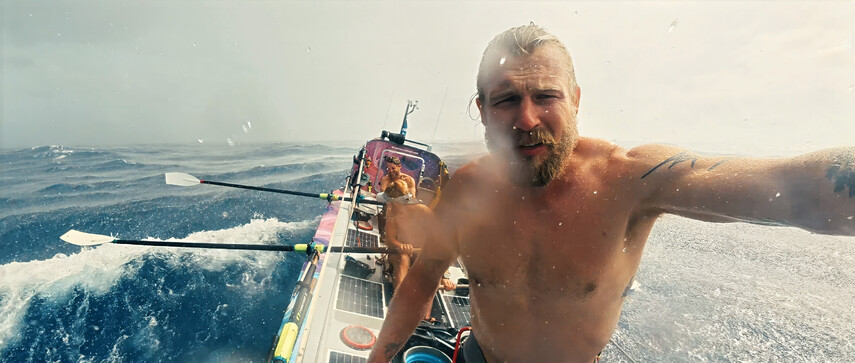 Maclean's brother battles strong ocean waves in a rowboat